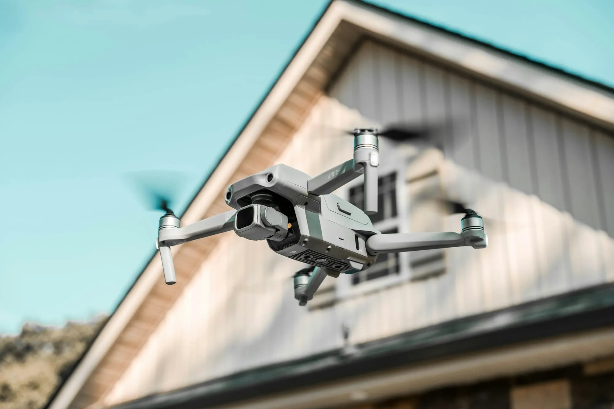 Drone inspecting a new build roof during an end of warranty survey Snag Surveys